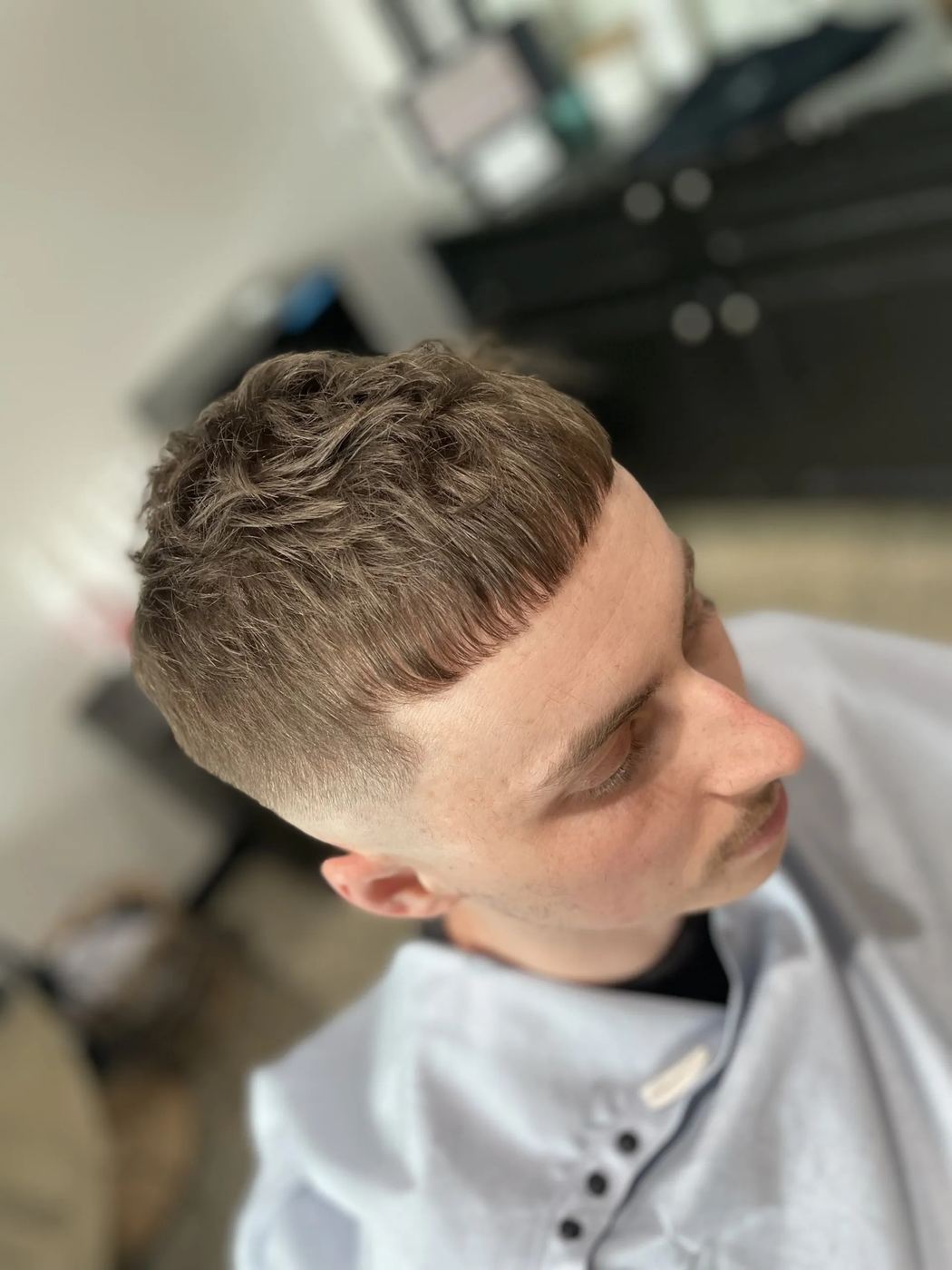 French crop with a blunt fringe and fade