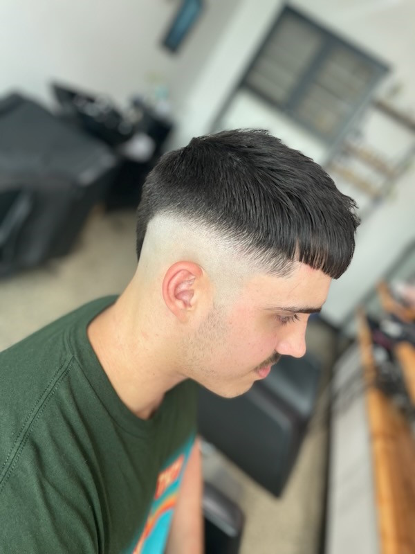 High burst fade with a straight crop fringe
